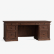 angled view of dark walnut executive desk