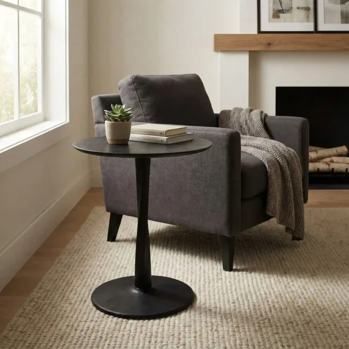 Black coffee table with a matching armchair
