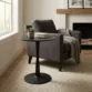 Black coffee table with a matching armchair