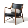 Incurve Leatherite Chair – Modern wooden frame chair with black leatherite upholstery and ergonomic design