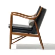 Incurve Leatherite Chair – Side view of a black leatherite lounge chair with a wooden frame and curved armrests