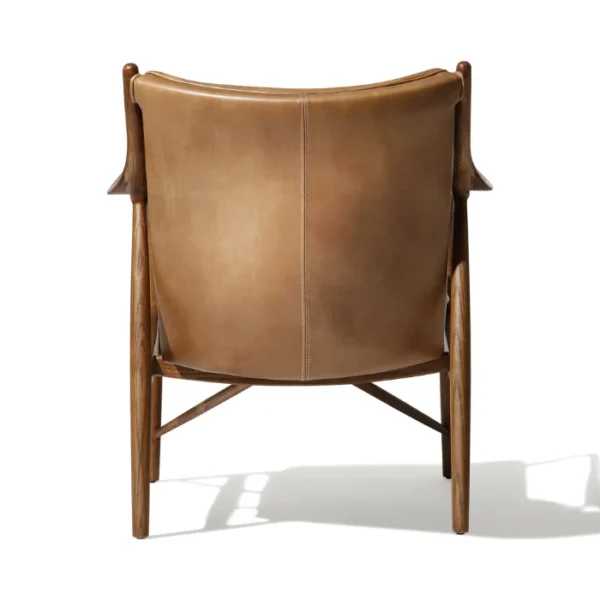 Incurve Leatherite Chair – Back view of a brown leatherite lounge chair with a wooden frame Incurve Leatherite Chair – Back view of a brown leatherite lounge chair with a wooden frame