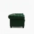 side profile view of dark green leather sofa