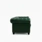 side profile view of dark green leather sofa