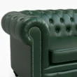 armrest close view of dark green leather sofa