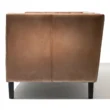 Side view of brown Lavender Pure Leather Sofa with sleek black wooden legs
