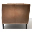 Side view of brown Lavender Pure Leather Sofa with sleek black wooden legs