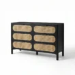 Angled view of black dresser in white backgound