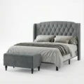 upholstered bed angled view with matching ottoman