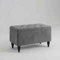 grey upholstered ottoman with wooden black legs