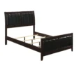 wooden bed with upholstered headboard showing wooden slats