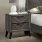 wooden side table in a bedroom.
