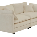Beige sofa with multiple cushions, featuring a modern and clean design, supported by black legs.