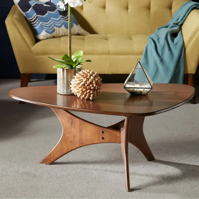 Orion Table with mid-century modern design featuring a triangular wood veneer tabletop, crossed geometric base, and solid plywood legs in Pakistan.