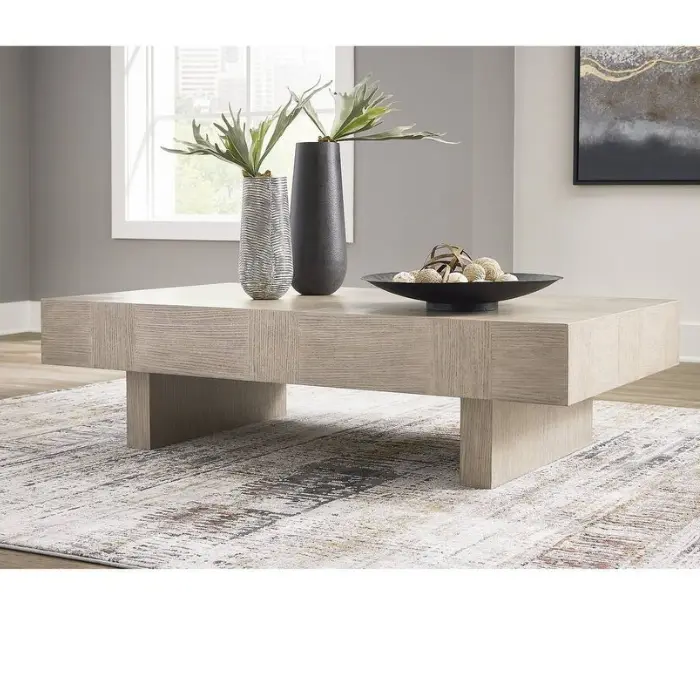 "Monarch Coffee Table with textural light gray finish, double-plinth base, and wire-brushed oak veneer design. Perfect for modern and traditional homes in Pakistan and UAE.