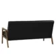Rear view of Carter Sofa, smooth black back panel with wooden legs for stability.