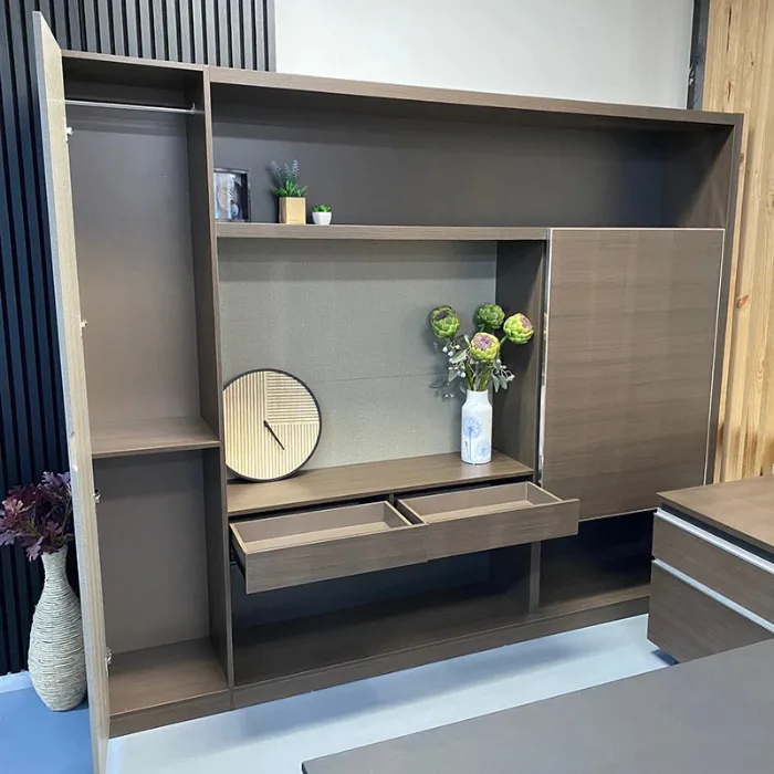 Wall storage cabinet with sliding panel open, revealing twin drawers and central display shelf.