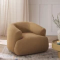 Angled view of upholstered armchair in a bedroom