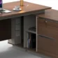 Close-up of Desk side return, open shelves and hidden cable management.
