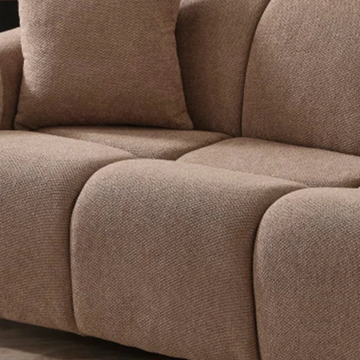 Close-up of textured brown upholstery sofa.