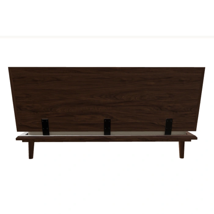 Back view of bed showing wooden headboard.