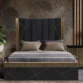 Cosmo Bed with black channel-tufted headboard, gold geometric accents, and platform base