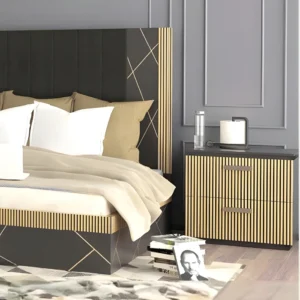 Cosmo Side table (4) Black-and-gold nightstand beside upholstered bed, fluted drawers and handles in a contemporary bedroom.