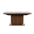 Front view of a rectangular dining table with fluted walnut pedestal base and rounded corners.