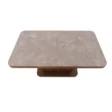 dining table showing round edged top marble surface.