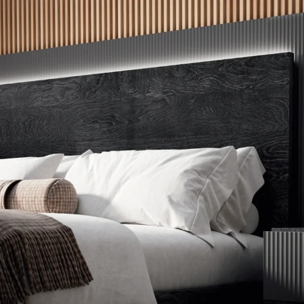 Eclipse Bed (5) Close-up of headboard wood grain and pillow arrangement.