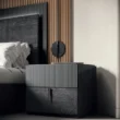 Side table beside bed showing cohesive bedroom setup.