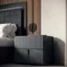 Side table beside bed showing cohesive bedroom setup.