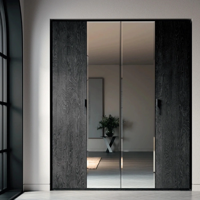 Eclipse Wardrobe with charcoal wood sides and mirrored sliding doors in a modern bedroom
