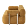 Side profile view of sofa emphasizing layered backrest and tubular metal supports.