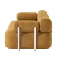 Side profile view of sofa emphasizing layered backrest and tubular metal supports.
