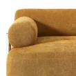 Front corner view highlighting the round arm cushion and smooth fabric finish.