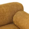 Detailed view of soft ochre upholstery showing plush texture and rounded backrest.