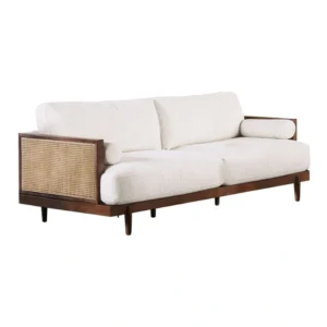 Side angle of 3-seater sofa showing cane arm detailing and plush seat cushions.