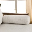 Bolster cushion detail of Sofa showing light beige textured fabric.