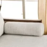 Bolster cushion detail of Sofa showing light beige textured fabric.