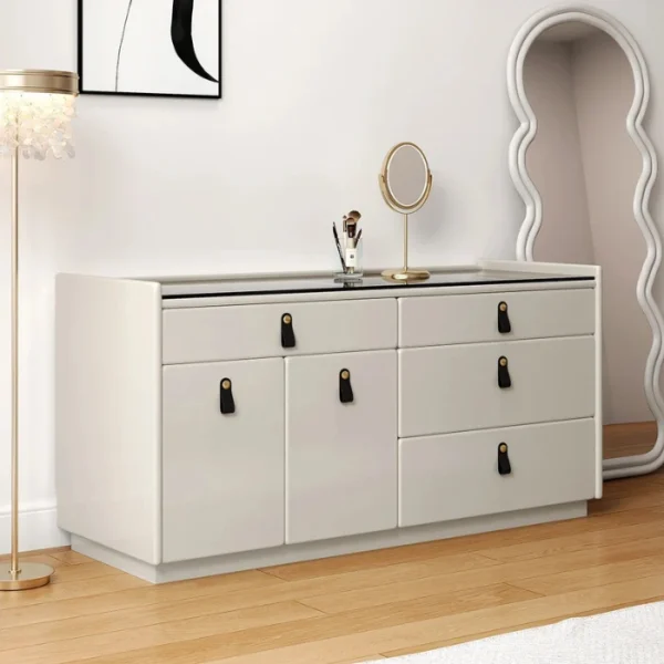 Angled view showing six drawers with leather pull handles