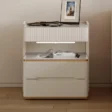 Linea Side Table - Sleek off-white design with ribbed texture, gold accents, and ample storage.