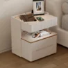 Modern off-white side table with marble top, ribbed detailing, and gold trim for a refined touch.
