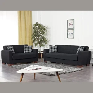 Marlo Living room Set – Black Marlo Living Room Set in black 3-seater and 2-seater sofas with plaid cushions, wood legs, coffee table and rug in a bright living room.