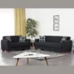 Marlo Living Room Set in black 3-seater and 2-seater sofas with plaid cushions, wood legs, coffee table and rug in a bright living room.