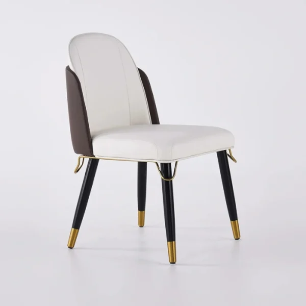 Three-quarter view showing white seat, mocha backrest, and subtle gold trim on a plain background.