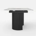 Extendable dining table side profile showing sculptural base.