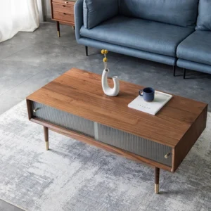 Nordic Coffee Table in Pakistan with glass doors and wooden legs.