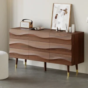 Nordic Haven Dresser – angled view of wooden dresser with wave-textured drawers and brass-accented legs.