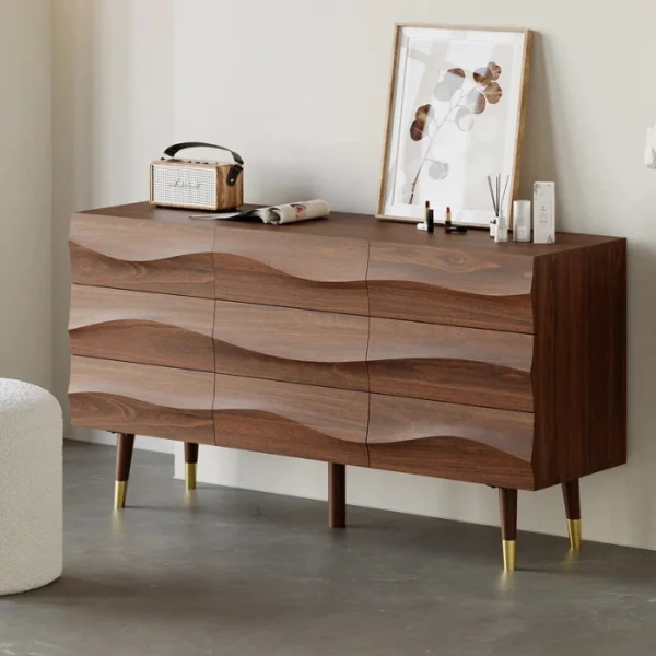 Nordic Haven Dresser – angled view of wooden dresser with wave-textured drawers and brass-accented legs.